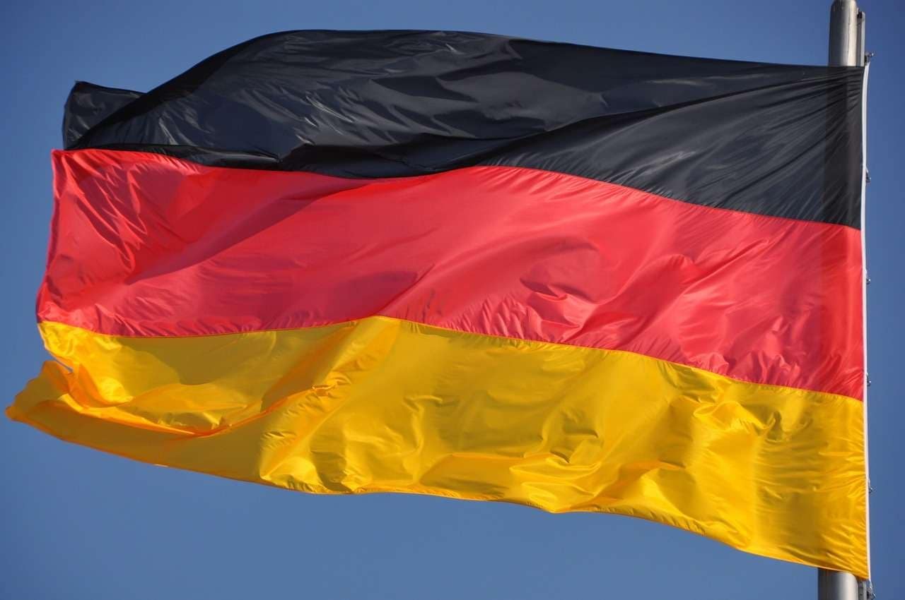 German flag under a blue sky.