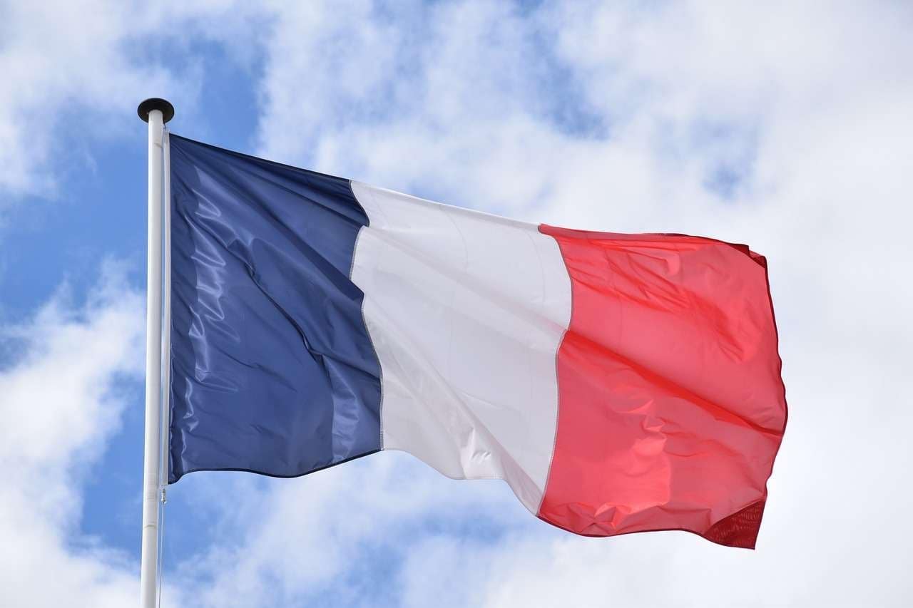 French flag under fair sky